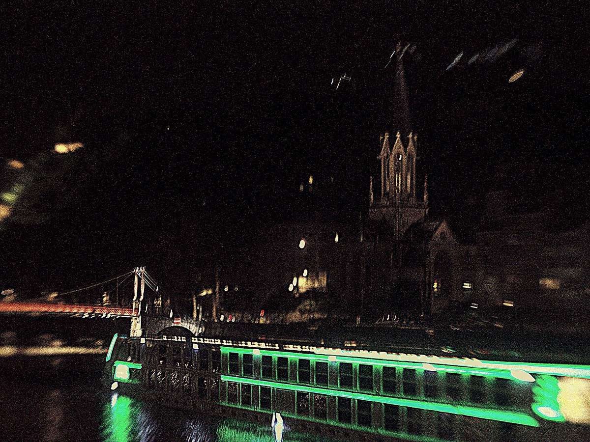 River cruise ship illuminated on the Saone in Lyon