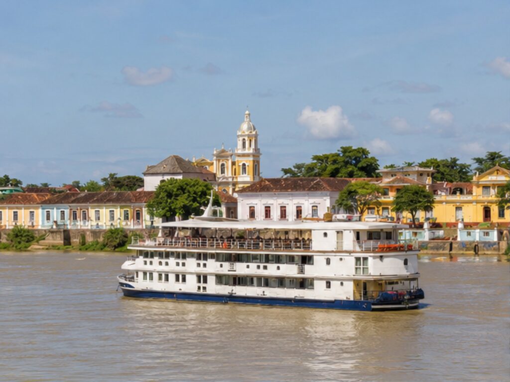 Small river cruise ship on Colombia's Magdalena River near colorful colonial Mompox