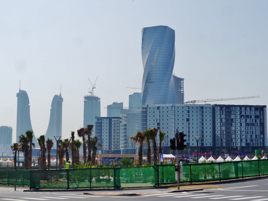 Modern towers and palm trees at Bahrain Bay in Manama