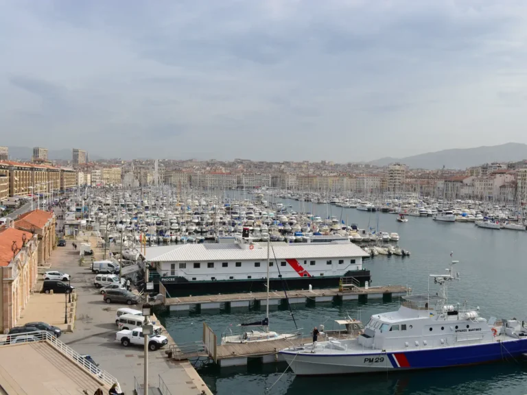 Panoramic view of boats and waterfront buildings at Marseille's Vieux-Port.