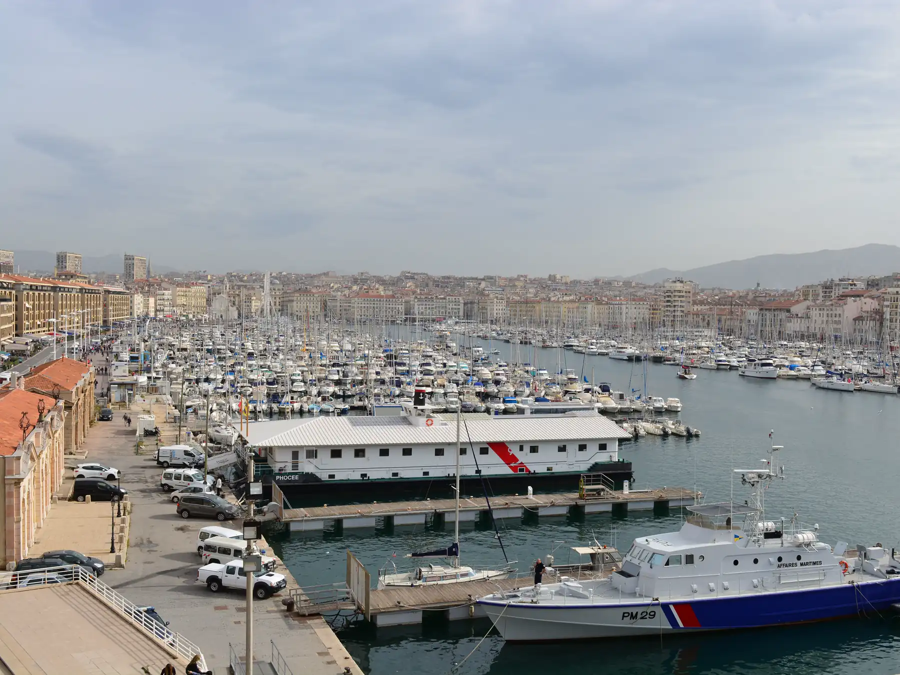 Panoramic view of boats and waterfront buildings at Marseille's Vieux-Port.