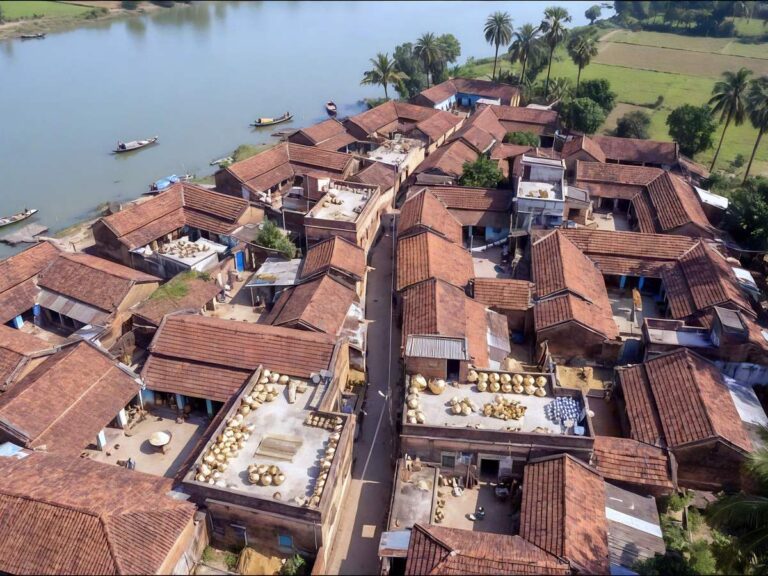 Aerial view of Matiari village beside the Hooghly River with boats along the riverbank