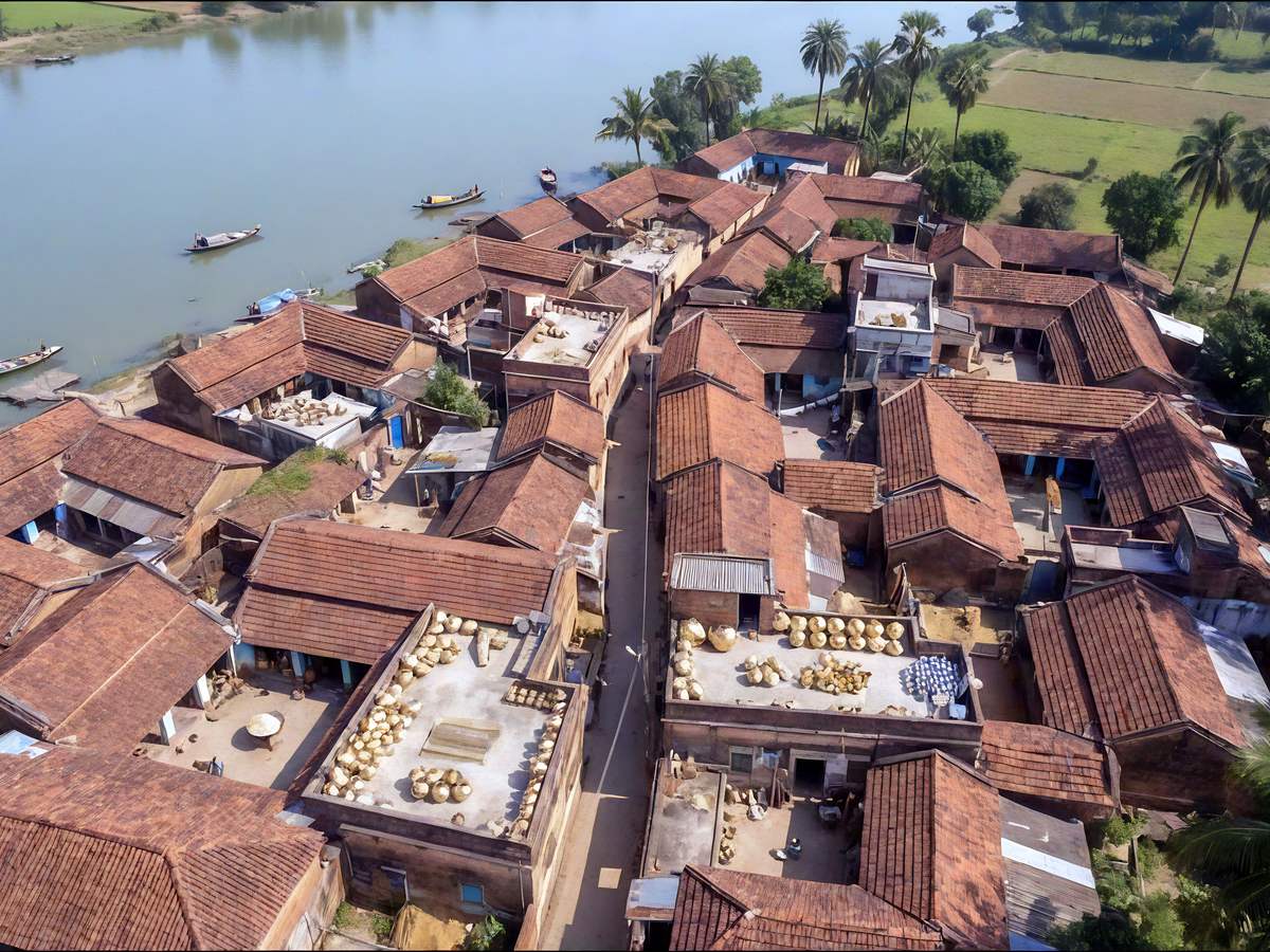 Aerial view of Matiari village beside the Hooghly River with boats along the riverbank