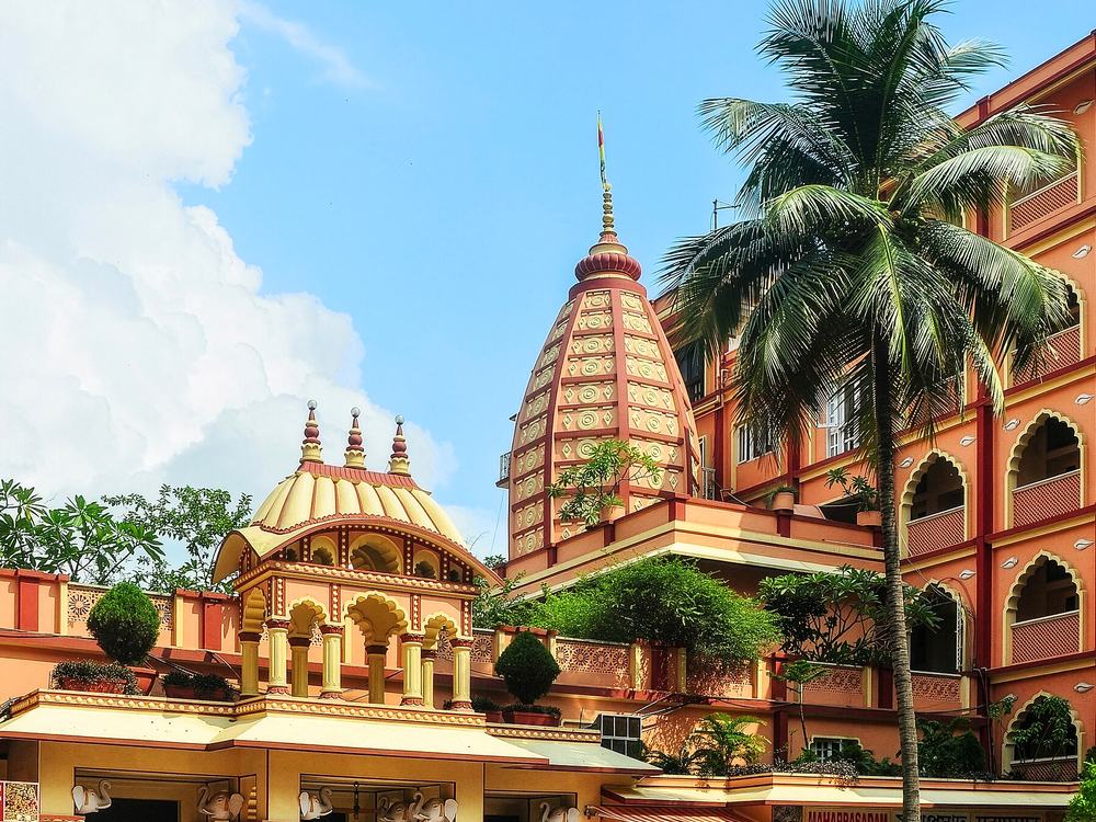 Sri Krishna Temple architecture and palm trees at ISKCON Mayapur