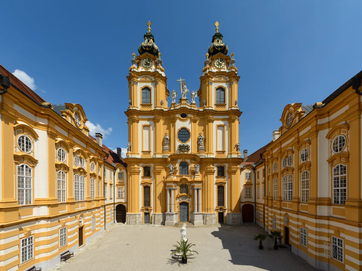 Baroque church facade and courtyard inside Melk Abbey