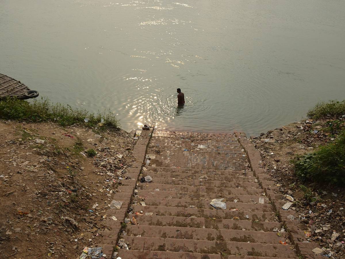 Stone steps of Hazarduari Bathing Ghat descending to the Bhagirathi River in Murshidabad