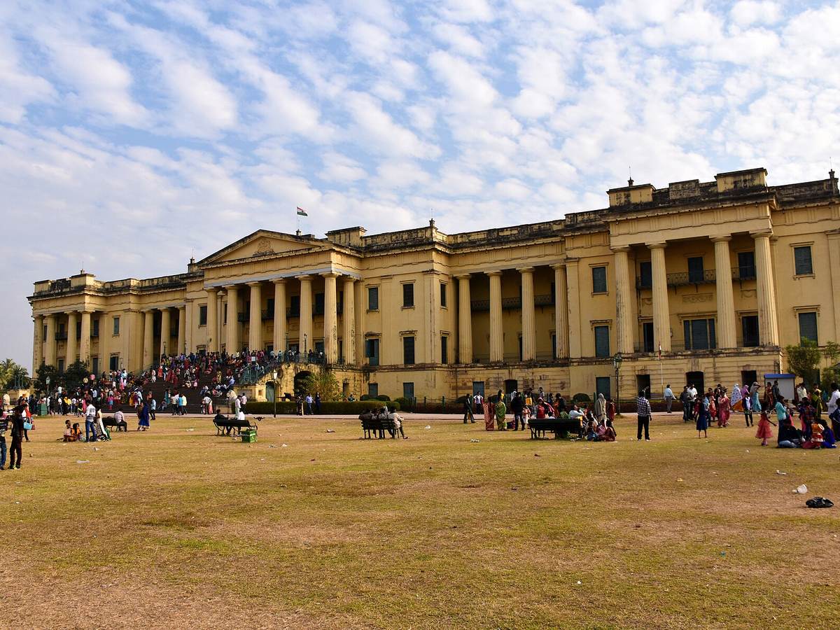 Yellow colonnaded facade of Hazarduari Palace in Murshidabad