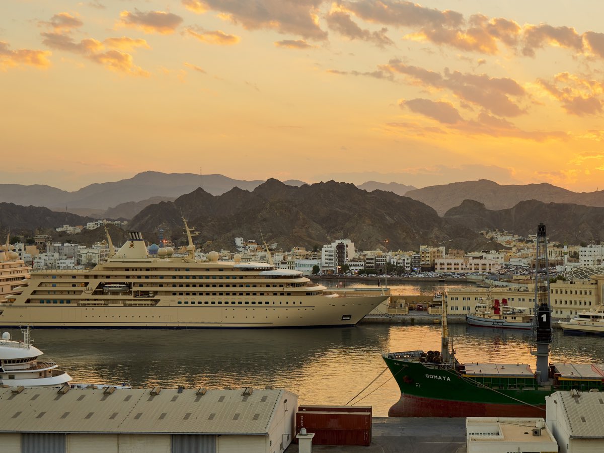 Cruise ship berthed at Port Sultan Qaboos in Muscat at sunset