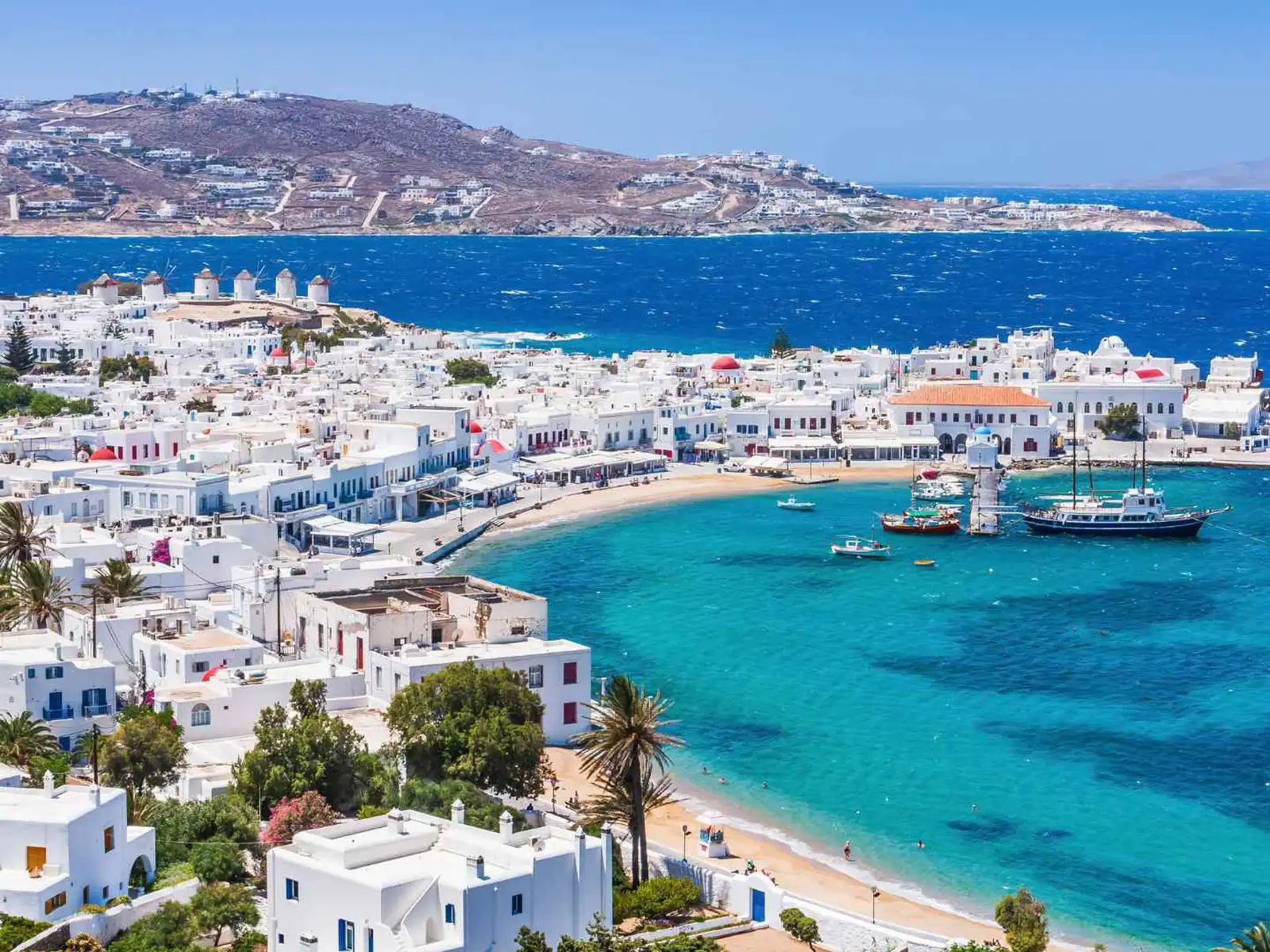 Whitewashed Mykonos waterfront and turquoise harbor