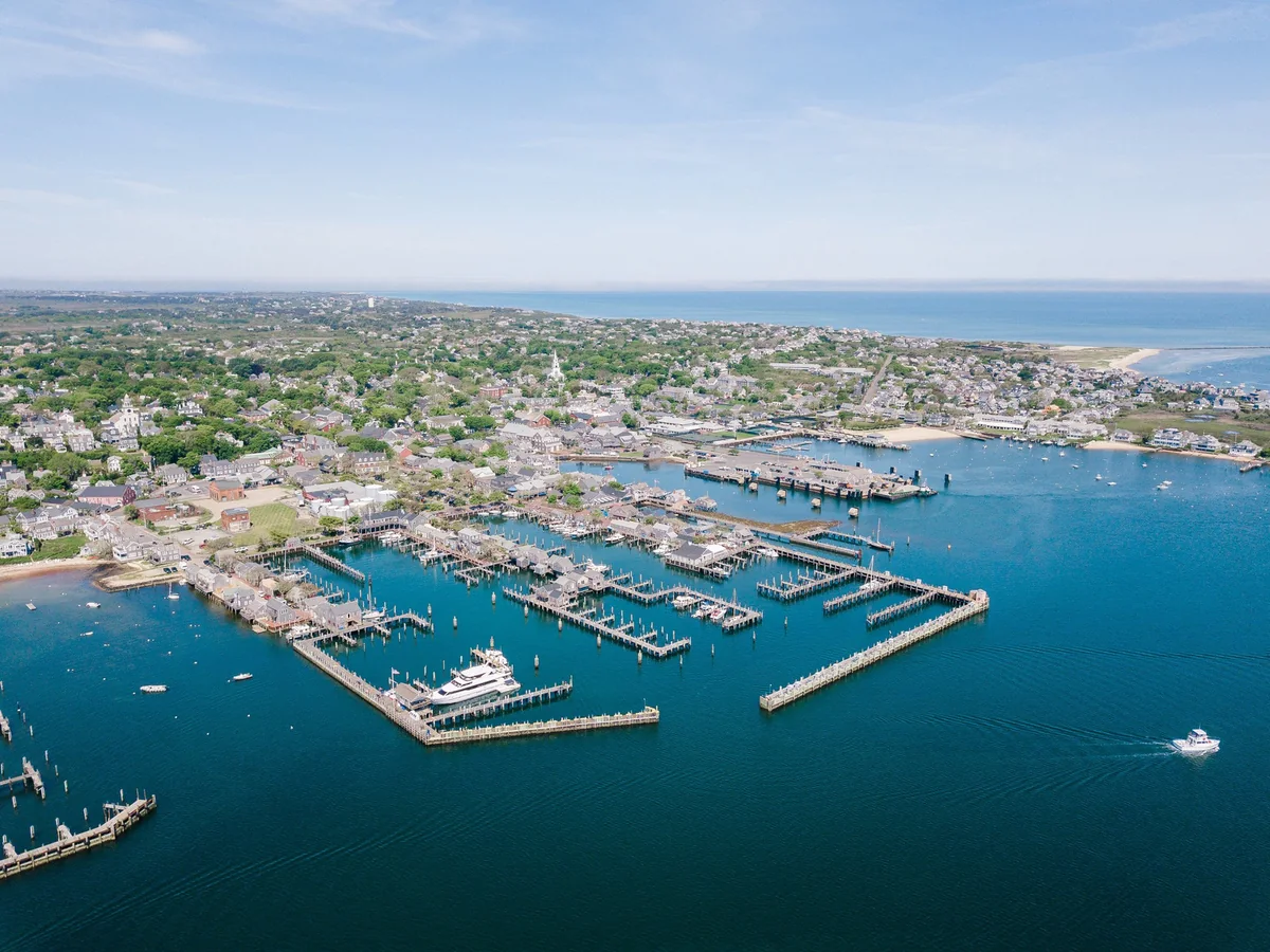 Aerial view of Nantucket Harbor, waterfront and marina piers