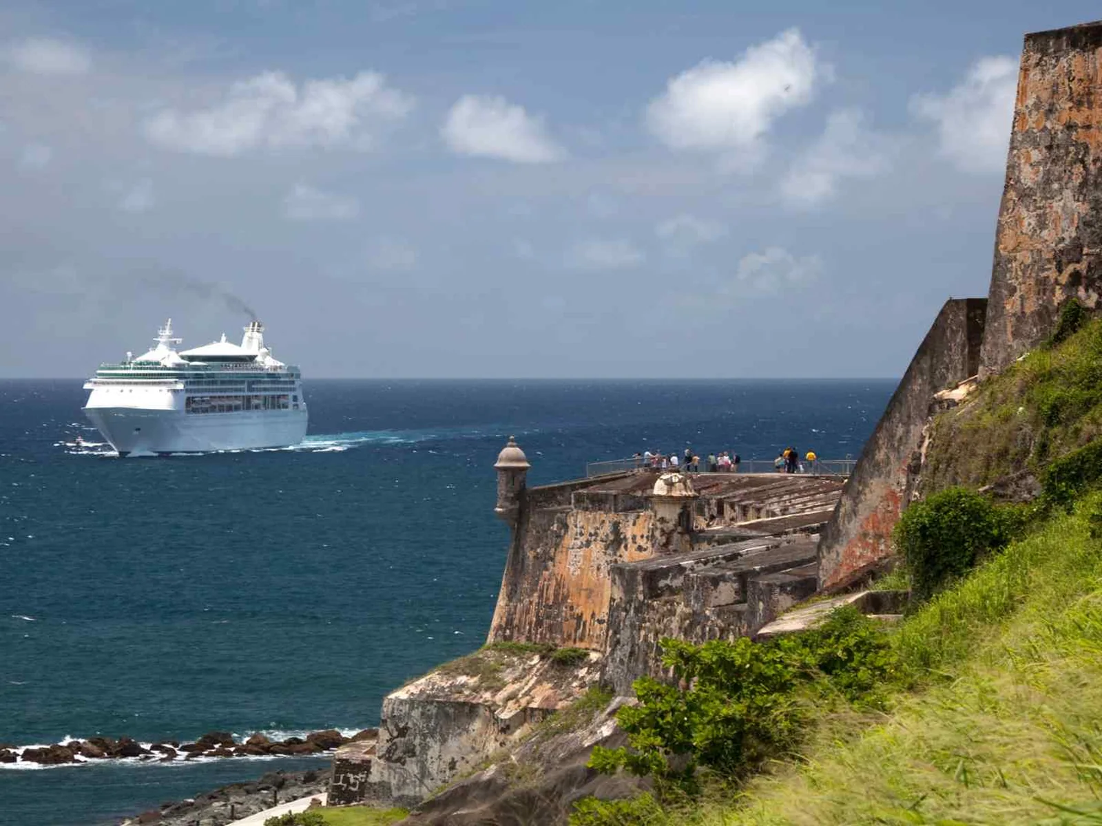 San Juan fort walls overlooking a cruise ship at sea