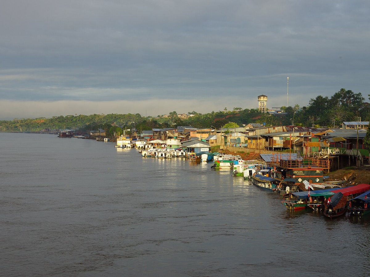 Passenger boats moored along the river port at Nauta, Peru