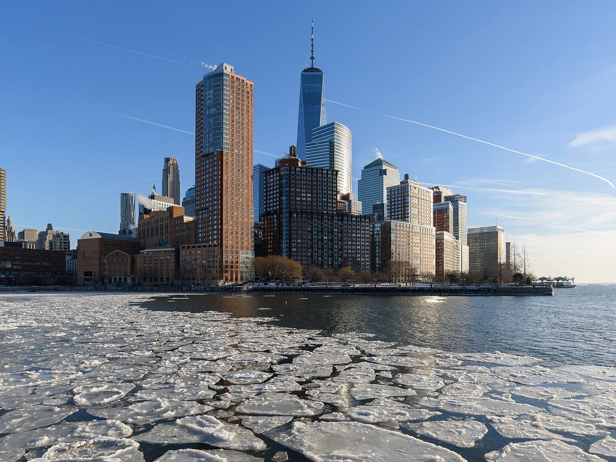 Battery Park City skyline above the frozen Hudson River in winter