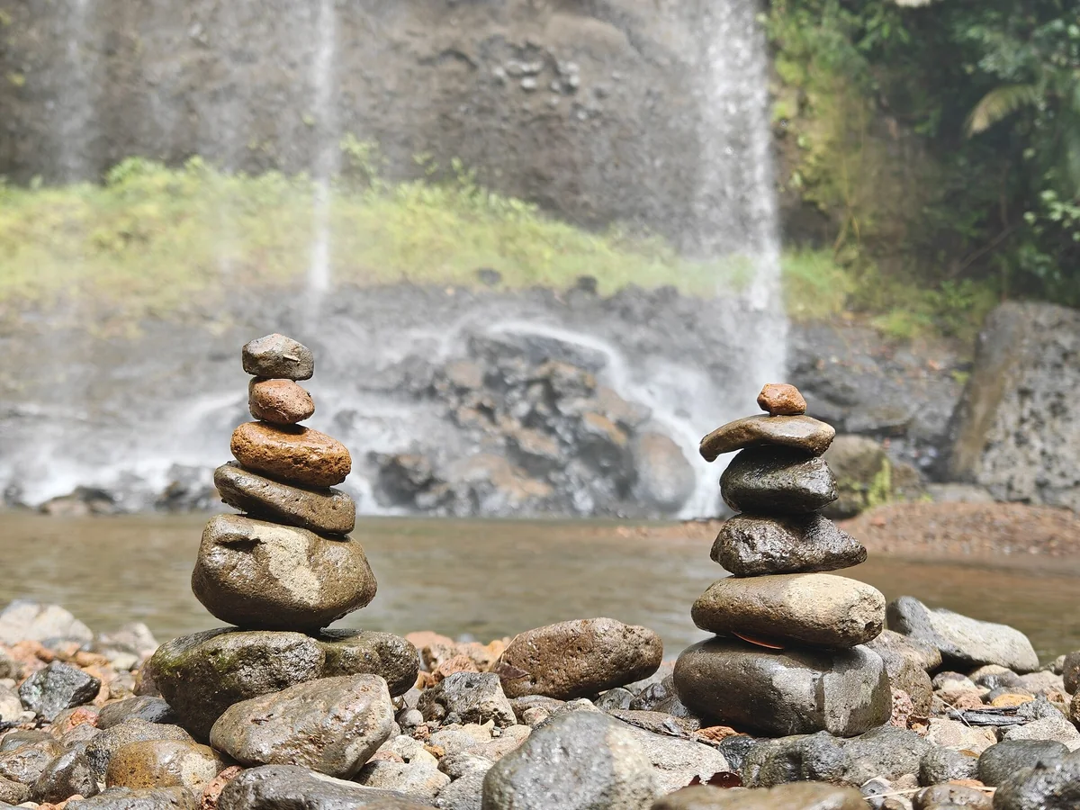 Ngardmau Waterfall and stacked stones in the Palau rainforest