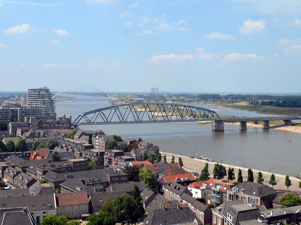 Nijmegen railway bridge. River Waal. in the back the Oversteek bridge Seen from the Stevenskerk in Nijmegen, Netherlands