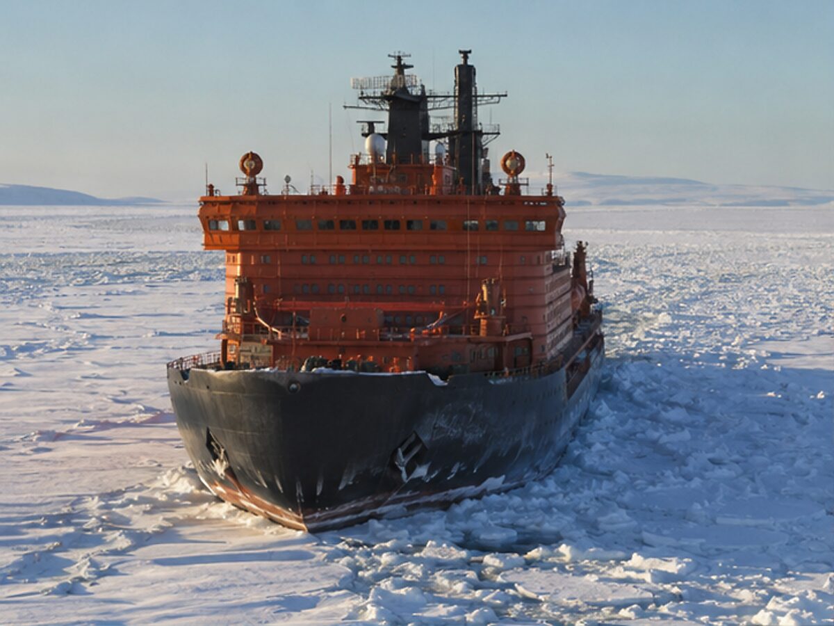 Powerful polar icebreaker cutting through Arctic pack ice