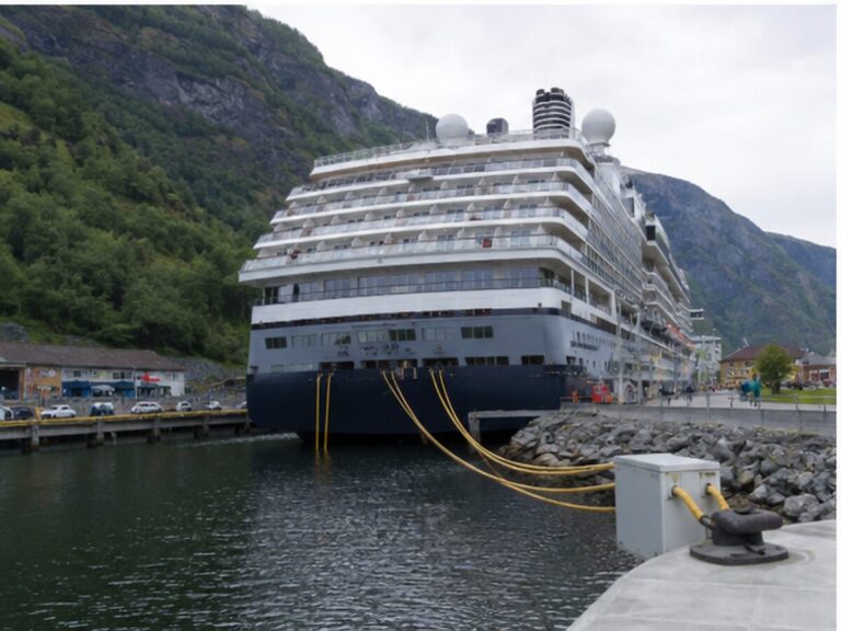 Cruise ship connected to shore power at a small Norwegian fjord port