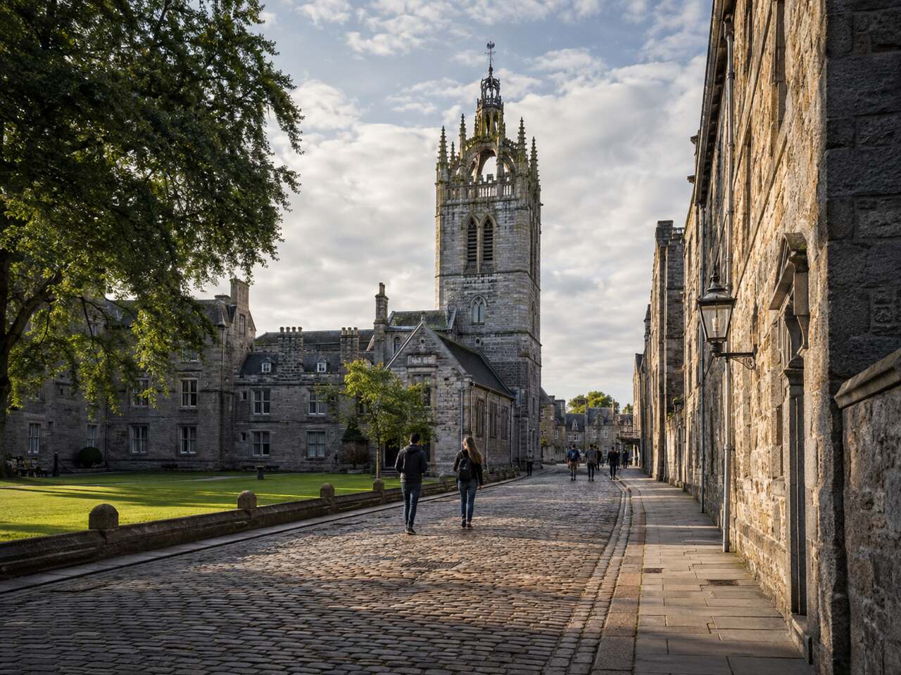 Historic cobbled street and crown tower of King's College Chapel in Old Aberdeen