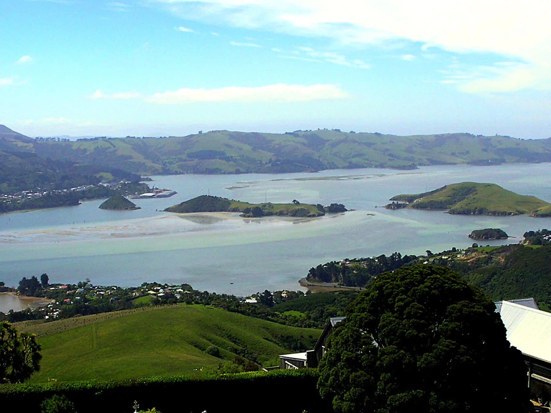Lower Otago Harbour, islands, and green hills viewed from near Port Chalmers.