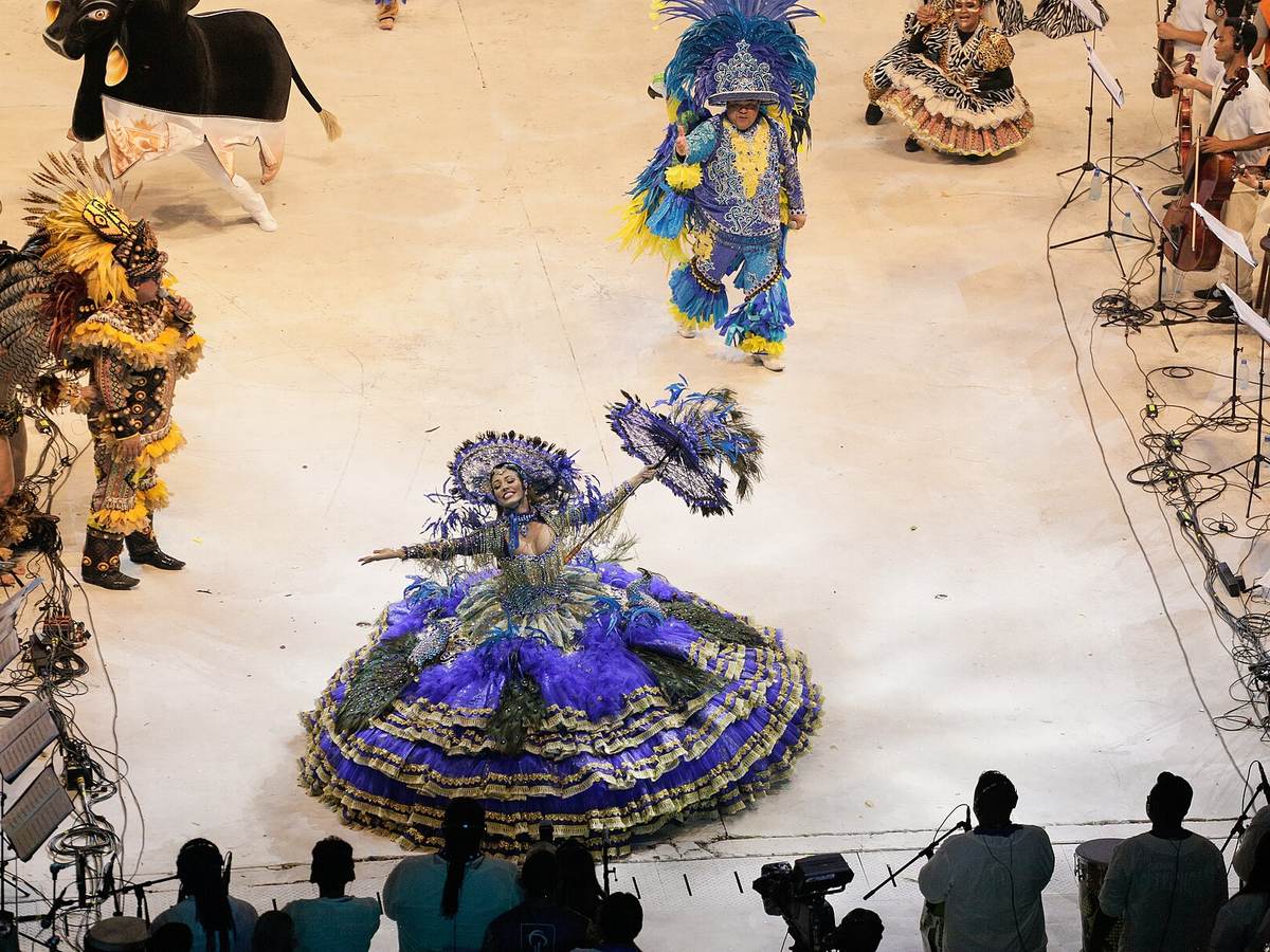 Boi-Bumbá performers in colorful costumes at the Parintins festival