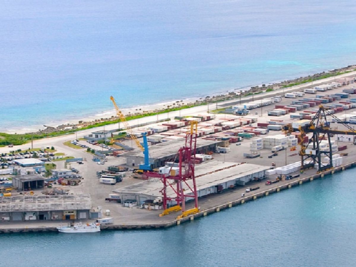 Cargo cranes and container yards at the Port of Guam commercial terminal