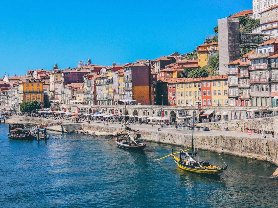 Traditional boats on the Douro River below Porto's colorful Ribeira district