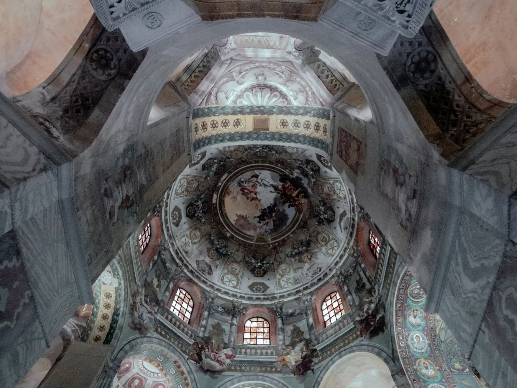 Ornate dome and arches inside the Basilica of San Vitale in Ravenna, Italy.
