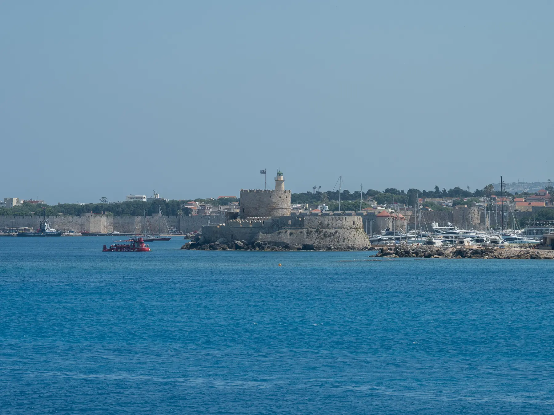 Medieval fortress and yachts in Rhodes harbor