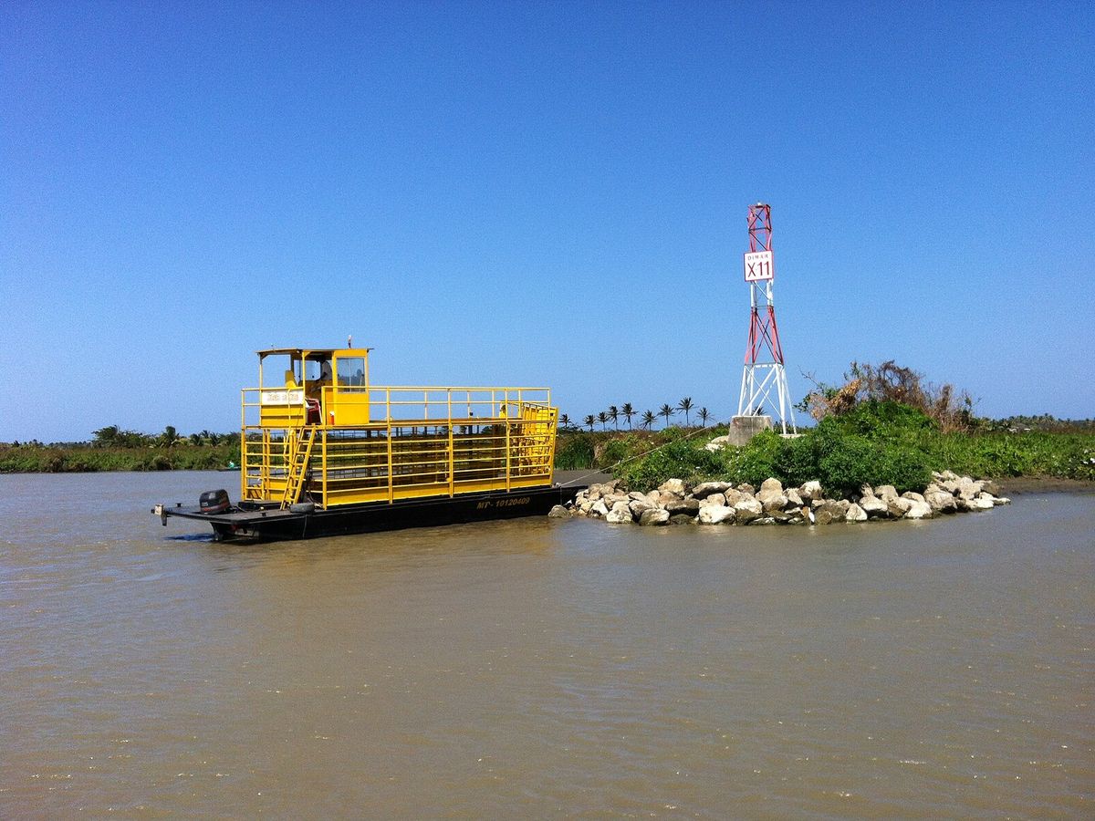 Yellow river ferry at Sitionuevo on the Magdalena River