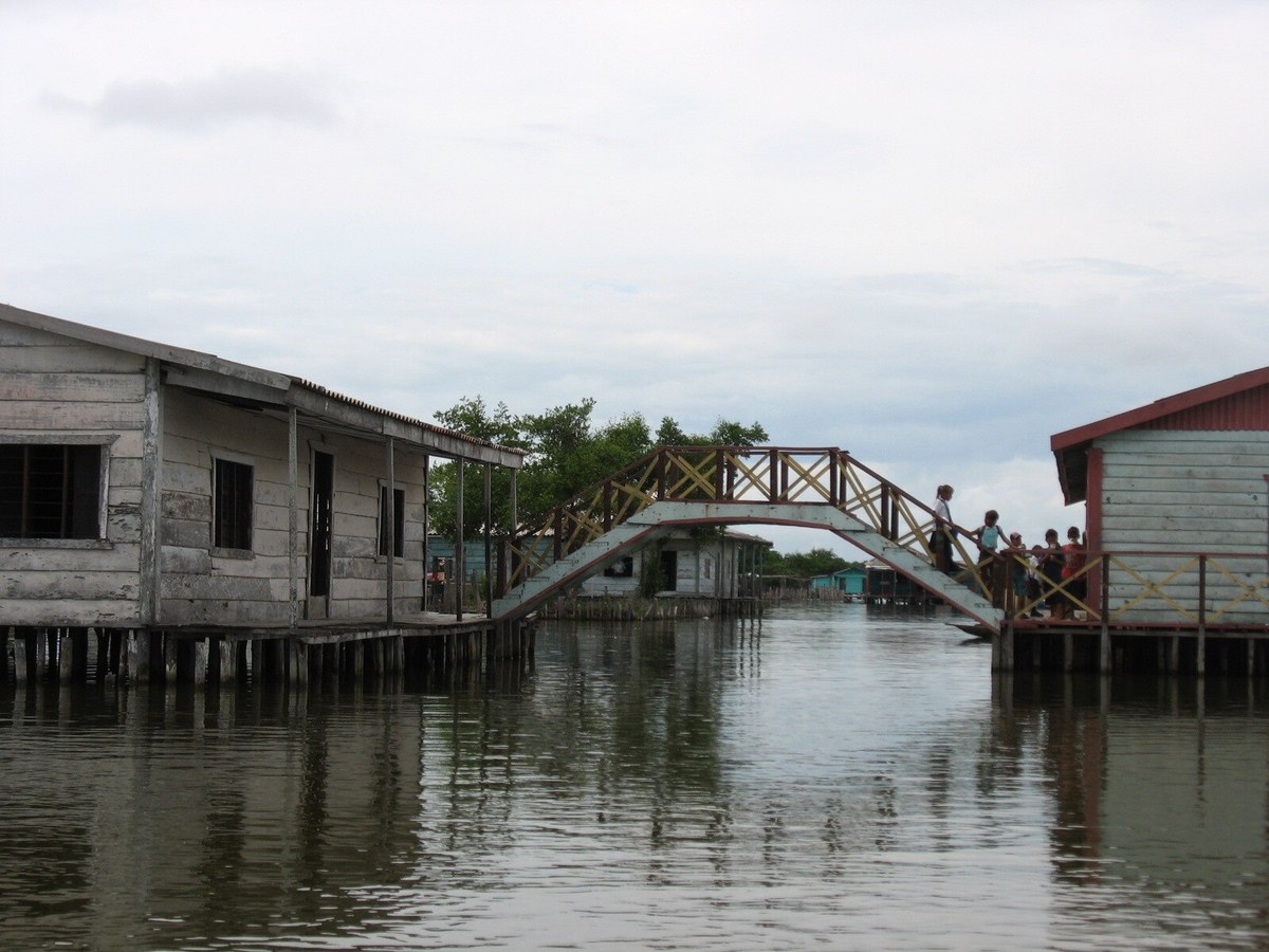 Wooden footbridge among stilt houses at Nueva Venecia in Sitionuevo