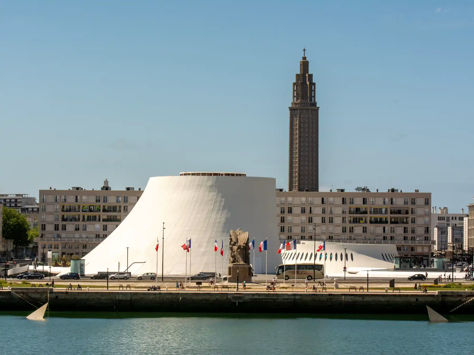 Saint Joseph Church tower rising above Le Havre's modern waterfront architecture.