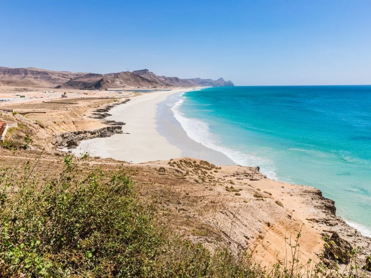White sand and turquoise water along Al Mughsail Beach near Salalah