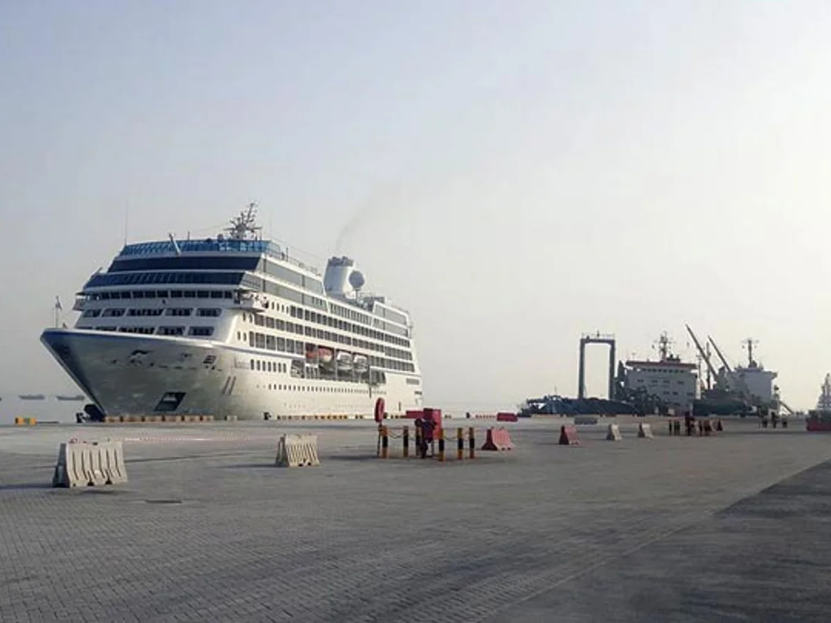 Cruise ship docked at the working cargo port in Salalah, Oman