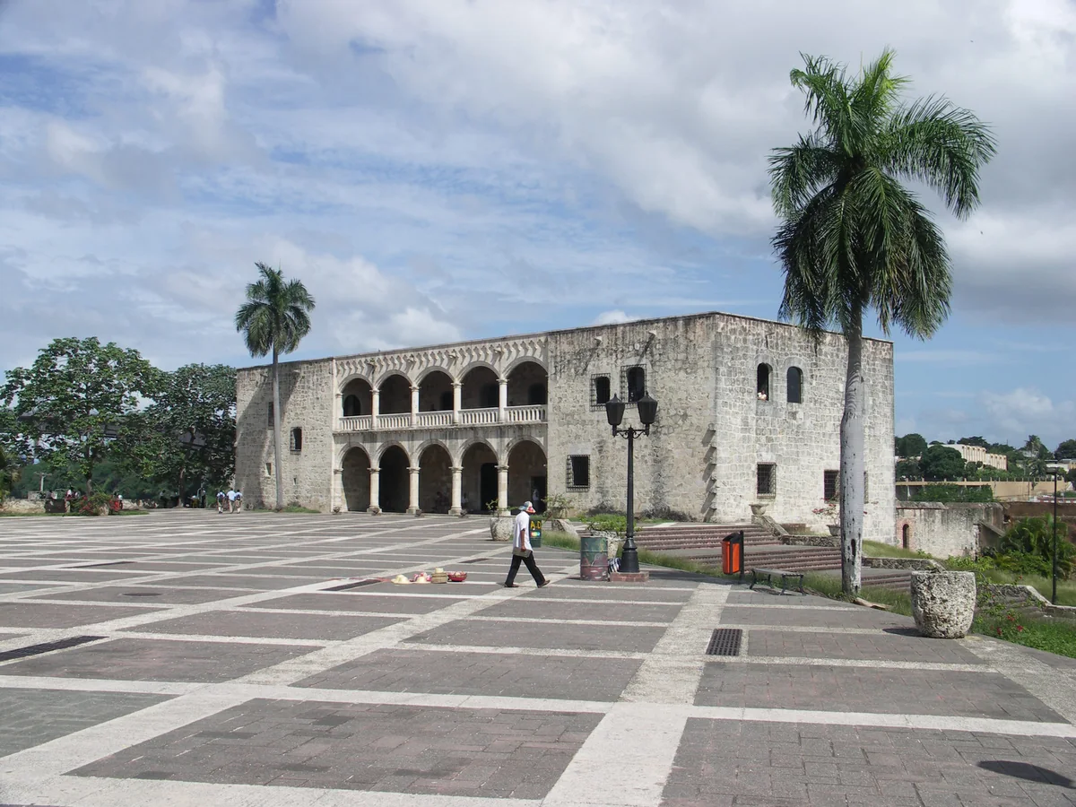 Stone arcades of the Alcázar de Colón beside Plaza de España in Santo Domingo