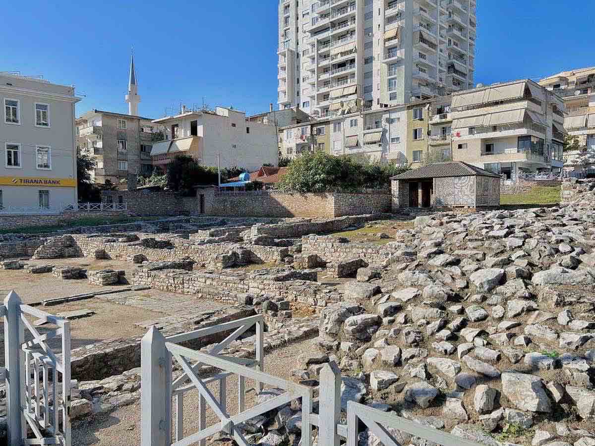 Archaeological remains among modern buildings in central Sarandë