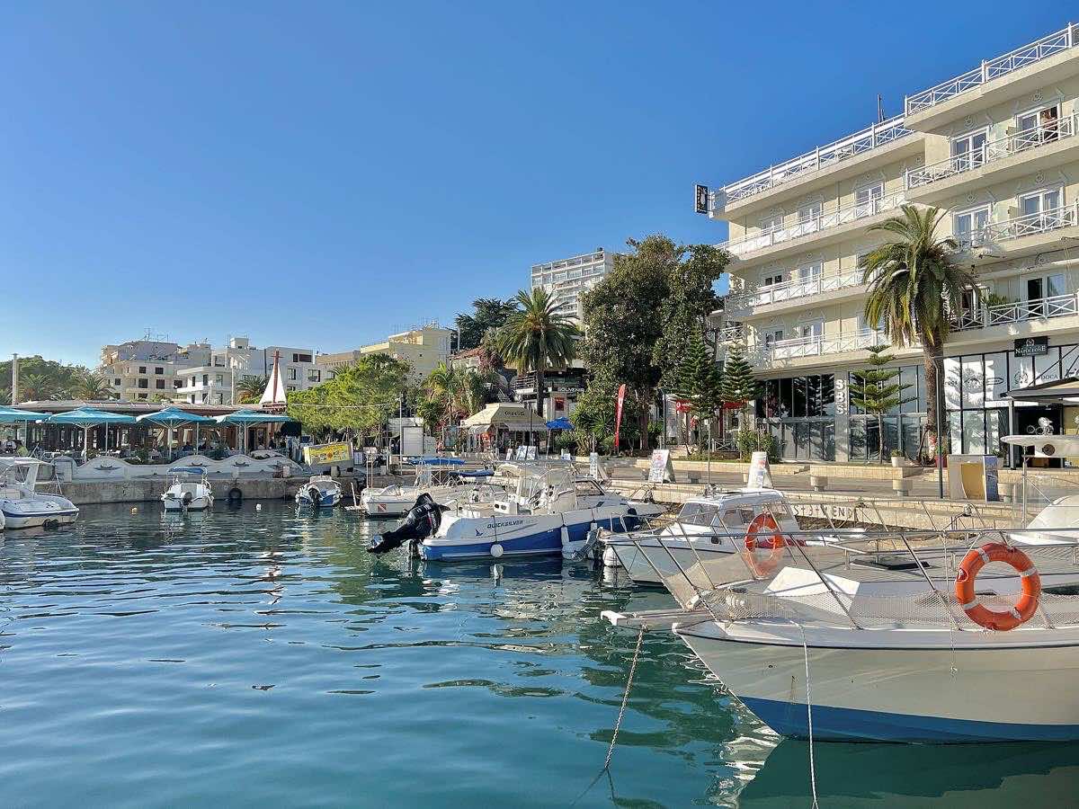 Small boats moored beside Sarandë's waterfront promenade