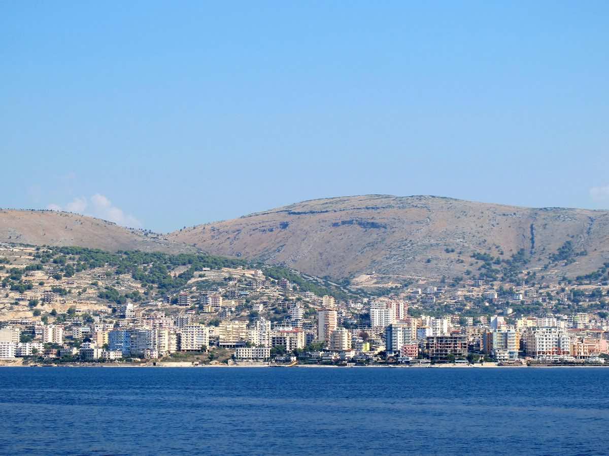 Sarandë waterfront and hillside buildings viewed from the Ionian Sea