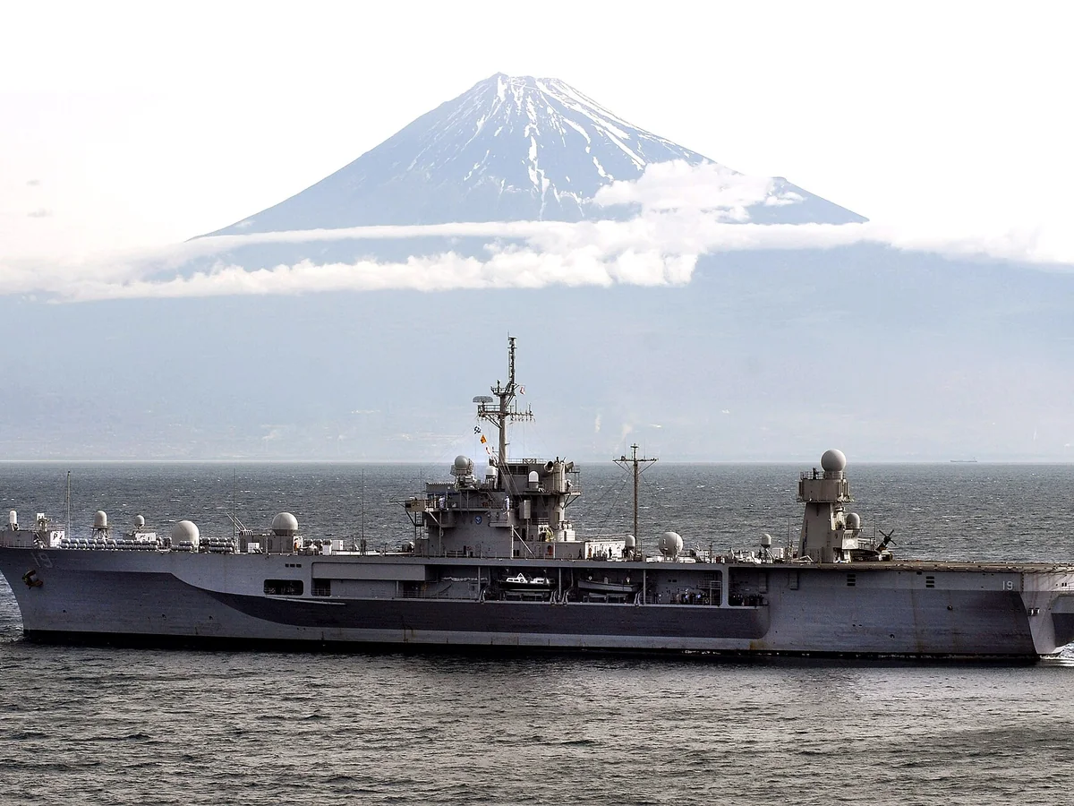 USS Blue Ridge sailing off Shimizu with Mount Fuji behind it