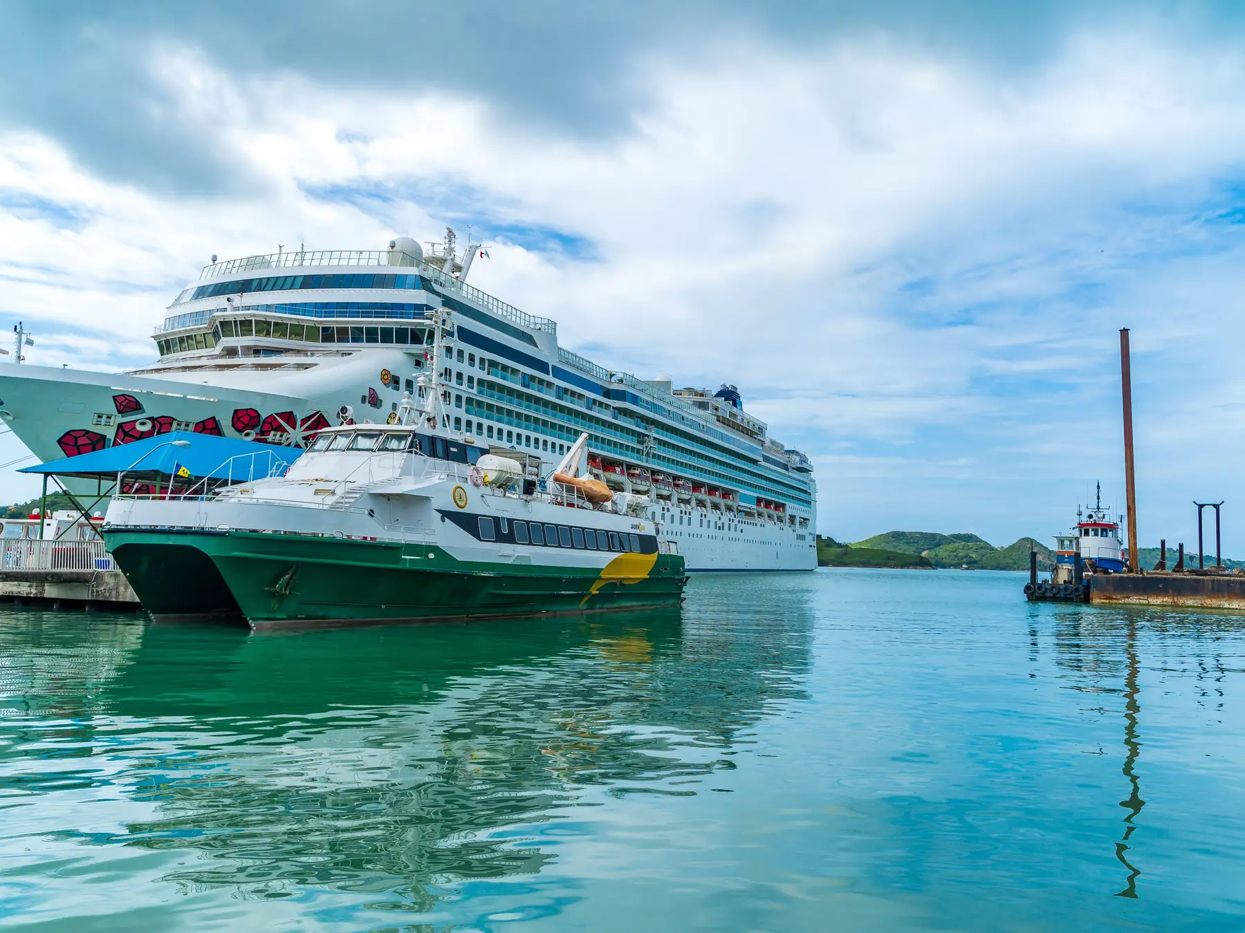 Cruise ships docked in the blue Caribbean harbor at St. John's, Antigua.