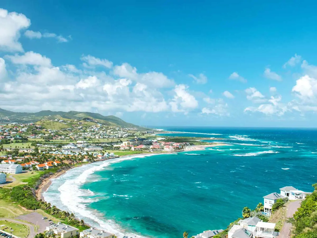 Atlantic coastline and hillside neighborhoods on Saint Kitts