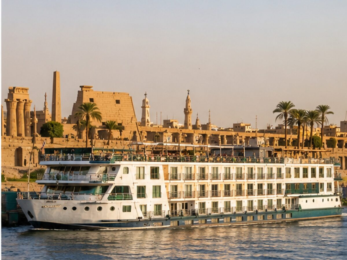 Large multi-deck Nile cruise boat sailing past Luxor, Egypt