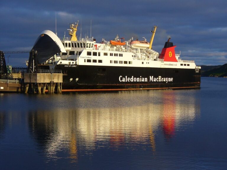 The MV Isle of Lewis ferry docked in Stornoway Harbour under dramatic clouds