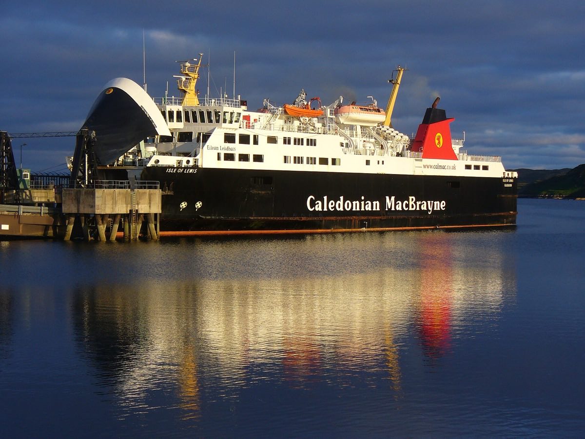 The MV Isle of Lewis ferry docked in Stornoway Harbour under dramatic clouds