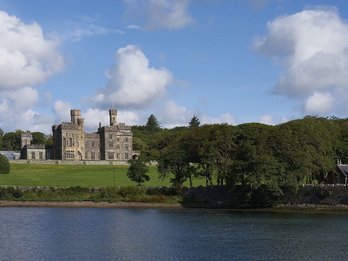 Lews Castle and its wooded grounds seen across the water in Stornoway