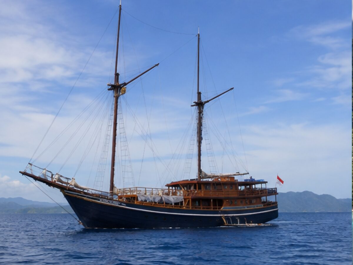 Traditional two-masted Indonesian phinisi sailing vessel at sea