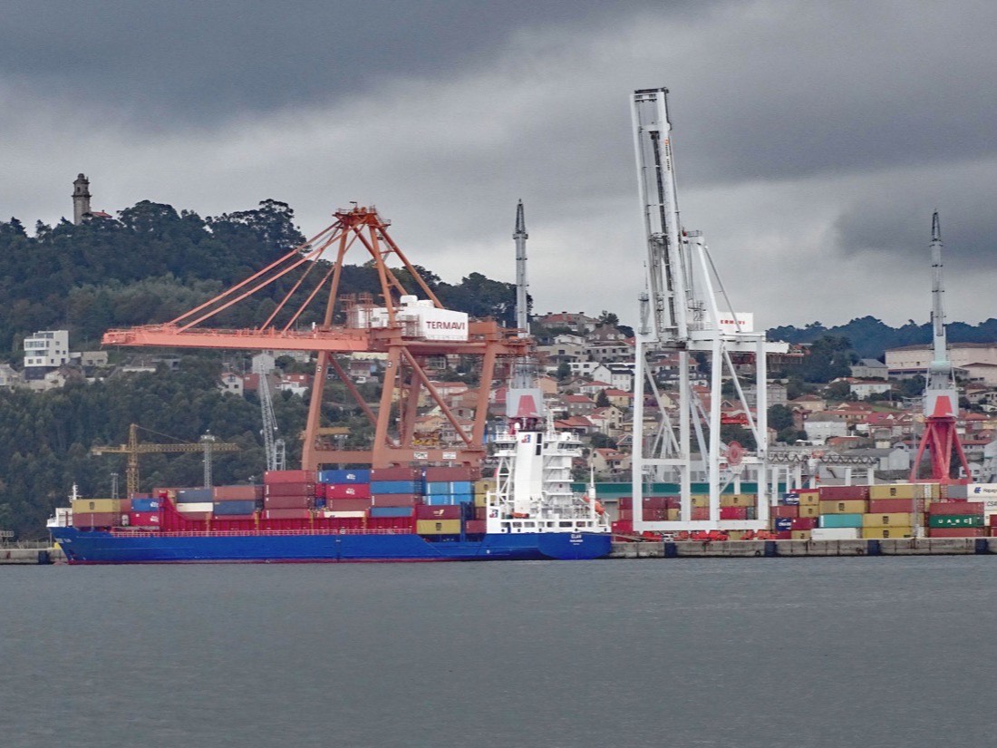Container ship and cargo cranes at the Port of Vigo in Spain