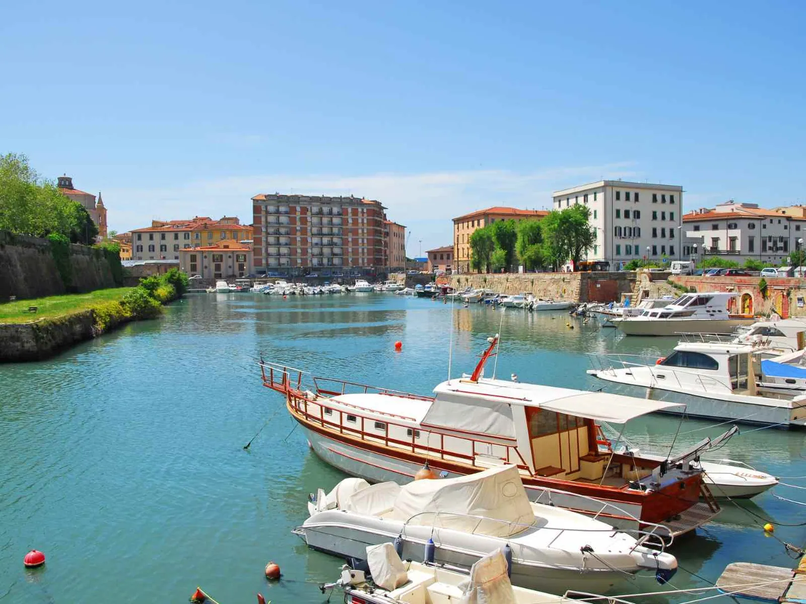 Small boats moored in Livorno's historic harbor