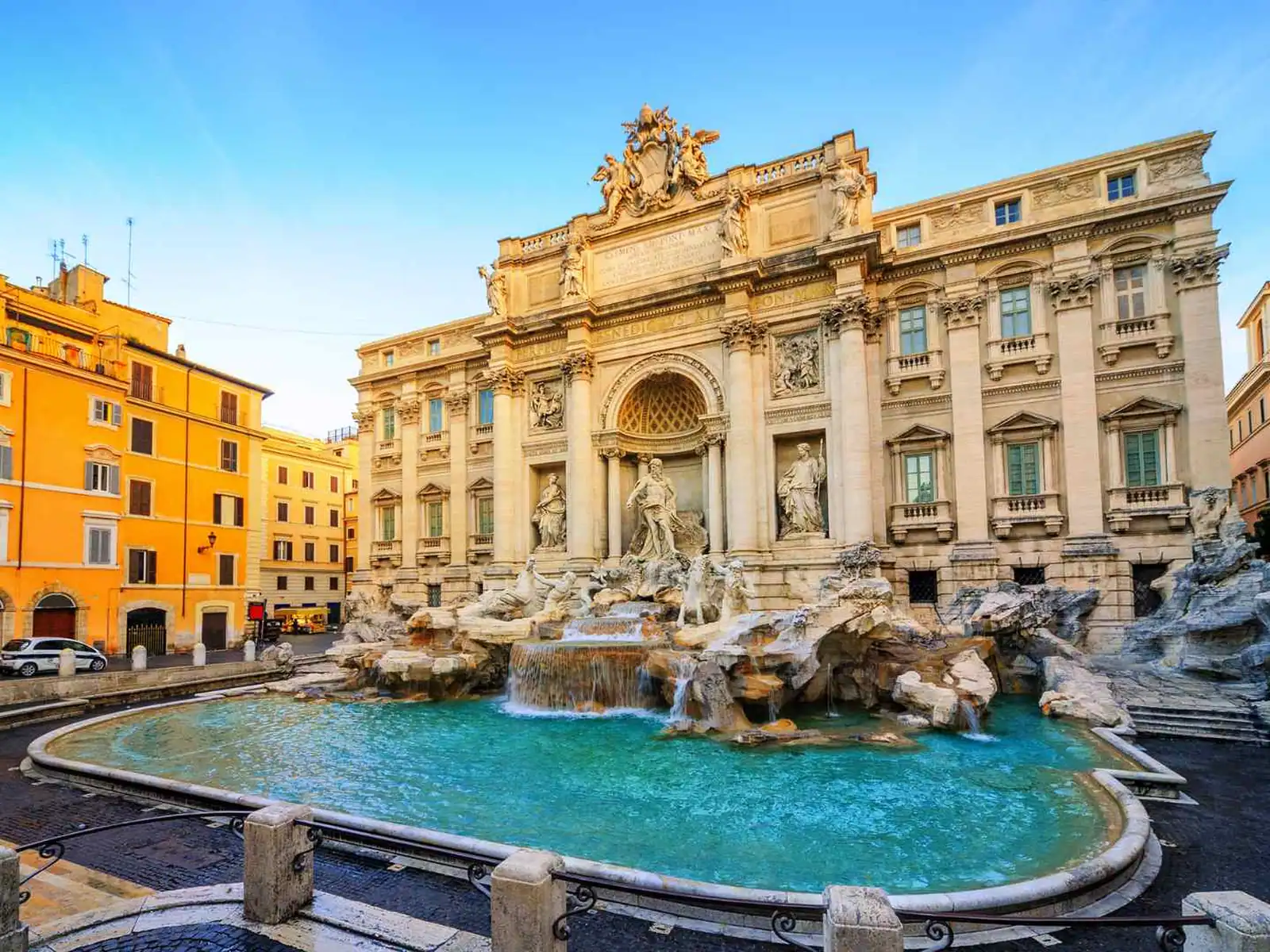 Trevi Fountain surrounded by historic buildings in Rome