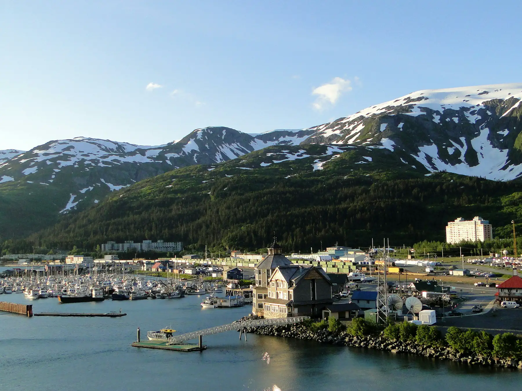 Whittier marina and snow-streaked mountains beside Passage Canal, Alaska
