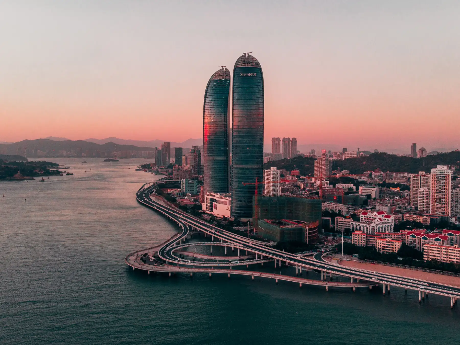 Xiamen skyline and coastline viewed from above at sunset
